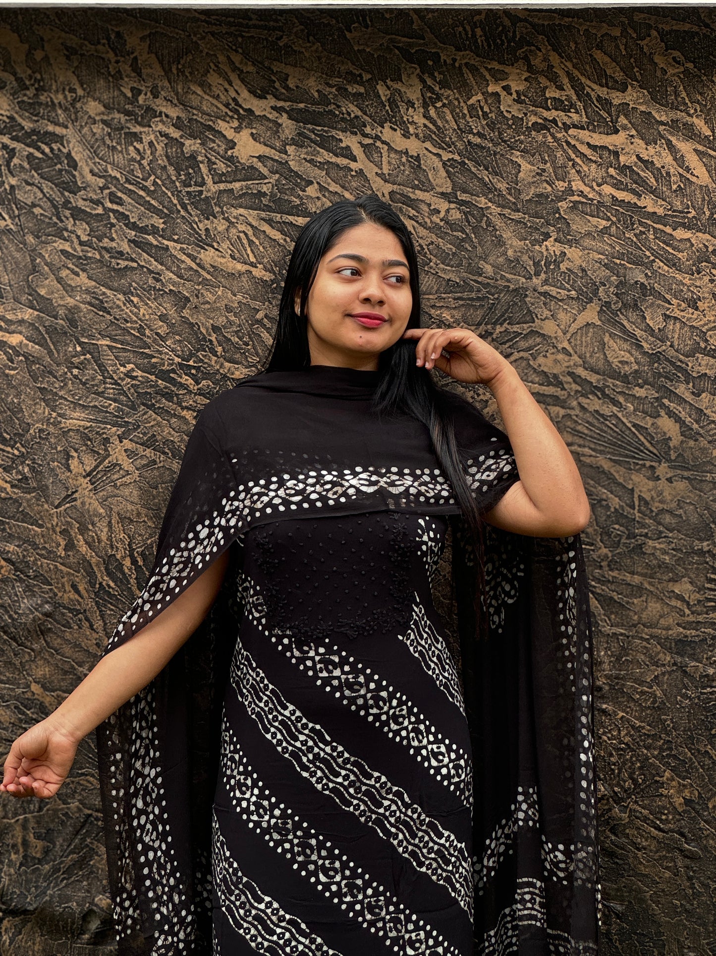 Unstitched three-piece set with intricate Chikankari threadwork on premium georgette fabric. - A1450